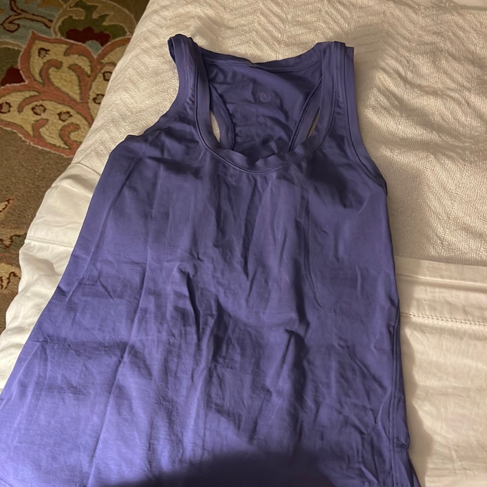Lululemon racer back tank top. Tag came out but it would fit a size small. 0-2